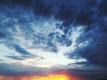 Low angle view of dramatic sky during sunset