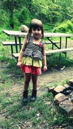 Girl standing on field at park