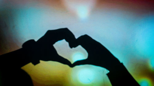 Shadow of person hand on wall