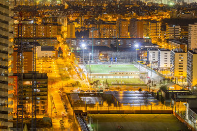 High angle view of illuminated buildings at night