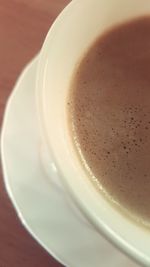 Close-up of cappuccino on table