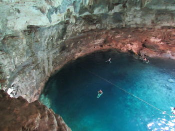 High angle view of people swimming in sea