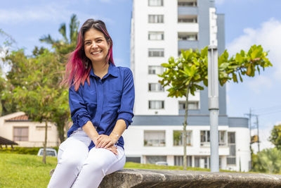 Portrait of smiling young woman outdoors