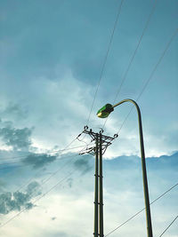 Low angle view of electricity pylon against sky