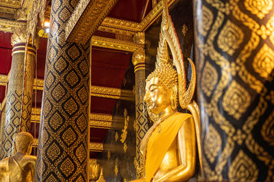 Low angle view of statue against temple building