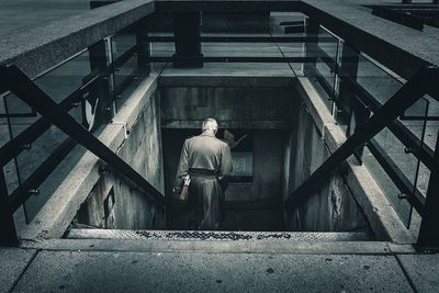 Rear view of man on staircase