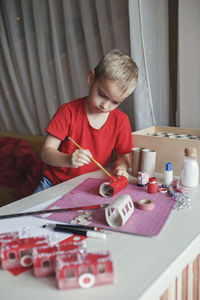 Boy playing with toys at home