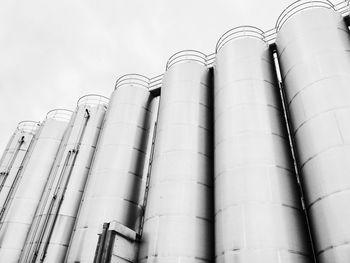 Low angle view of factory against sky