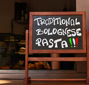 Close-up of information sign board in store
