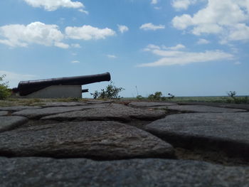 Close-up of stone wall against sky