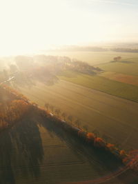 Scenic view of field against sky during sunset