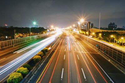 High angle view of light trails on road at night