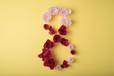 Directly above shot of apple on table against yellow background