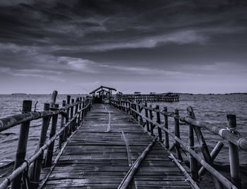 Pier over sea against sky