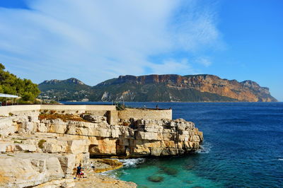 Scenic view of sea against cloudy sky