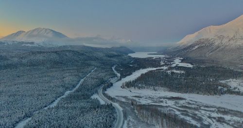 Scenic view of snowcapped mountains against sky