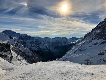 Scenic view of snowcapped mountains against sky