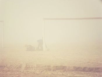 Man sitting against clear sky