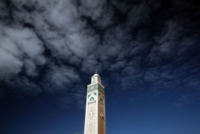 Low angle view of mosque hassan ii against sky in city