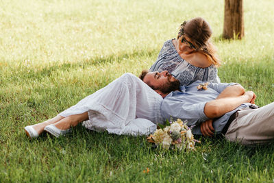 Couple lying on grass