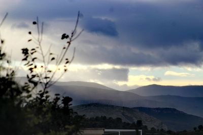 Scenic view of silhouette mountains against sky at sunset