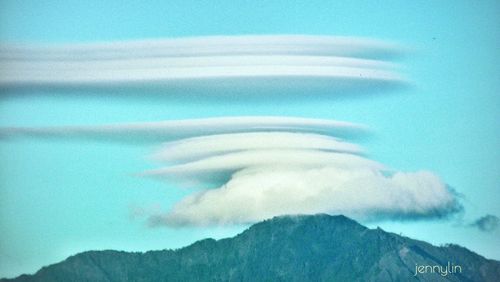 Close-up of turtle on mountain against sky