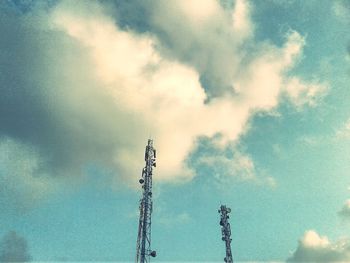 Low angle view of communications tower against sky