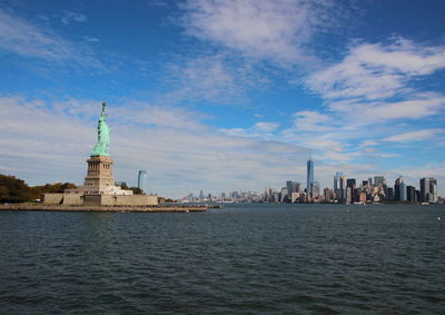 Statue of liberty against cloudy sky