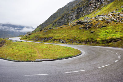 Scenic view of mountain road against sky