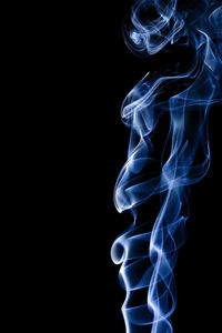 Close-up of smoke against black background