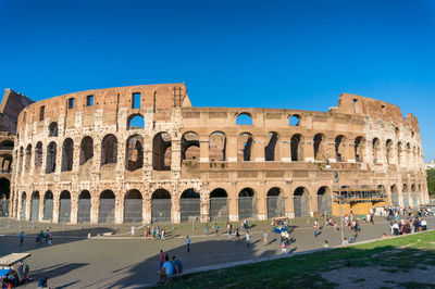 Group of people in front of historical building