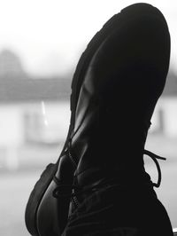 Close-up of woman looking at camera against sky