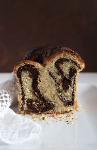 Traditional romanian sweet bread named cozonac with cacao, raisins, and nuts.