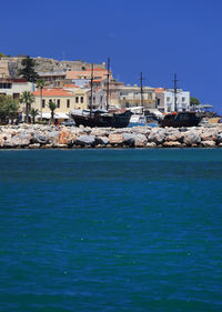 Scenic view of sea against clear blue sky