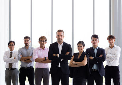 Group of people standing against the wall