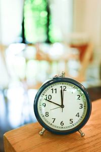 Close-up of clock on table