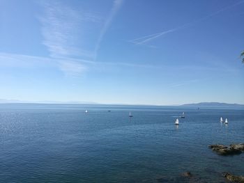 Scenic view of sea against blue sky