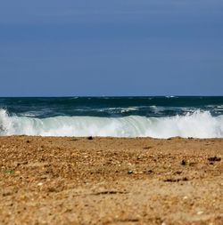 Scenic view of beach against clear sky