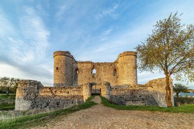 Low angle view of old ruins against sky