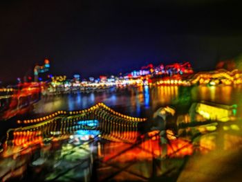 Illuminated buildings in city at night