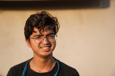 Portrait of young man wearing eyeglasses