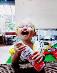 Portrait of boy holding ice cream outdoors