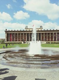 Fountain with buildings in background