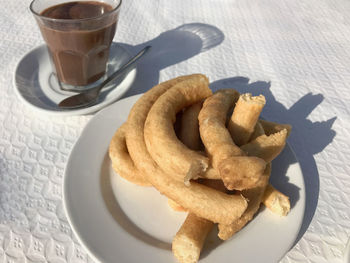 High angle view of cookies and coffee on table