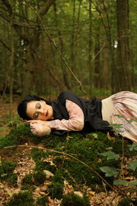 Portrait of young woman in forest