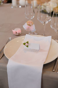 Close-up of wine glasses on table