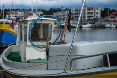 Close-up of fishing boat moored at harbor