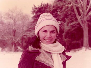Portrait of a smiling woman in snow