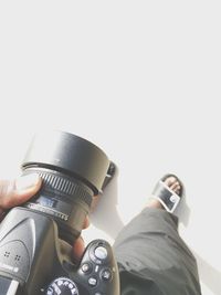 Woman photographing through camera