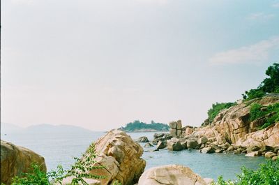 Panoramic view of sea and mountains against sky